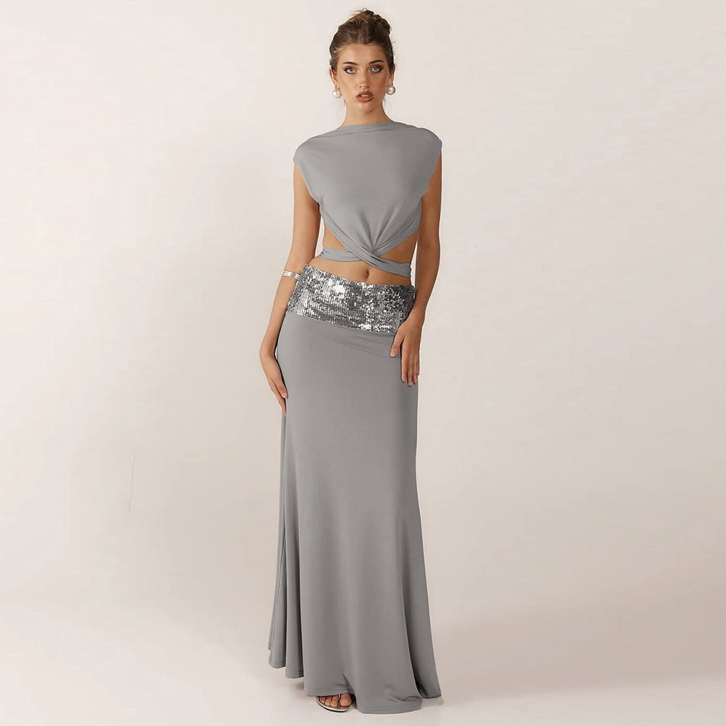 Elegant Backless Top Paired With A Patchwork Maxi Skirt