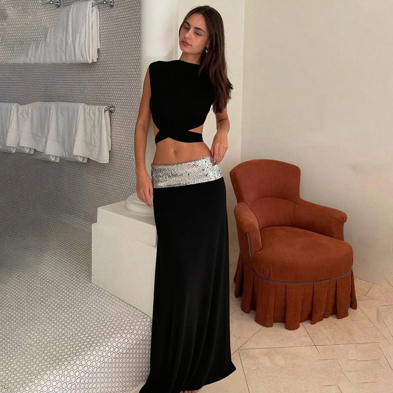Elegant Backless Top Paired With A Patchwork Maxi Skirt