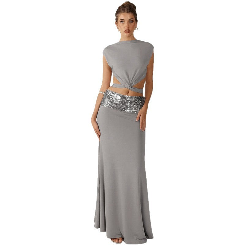 Elegant Backless Top Paired With A Patchwork Maxi Skirt