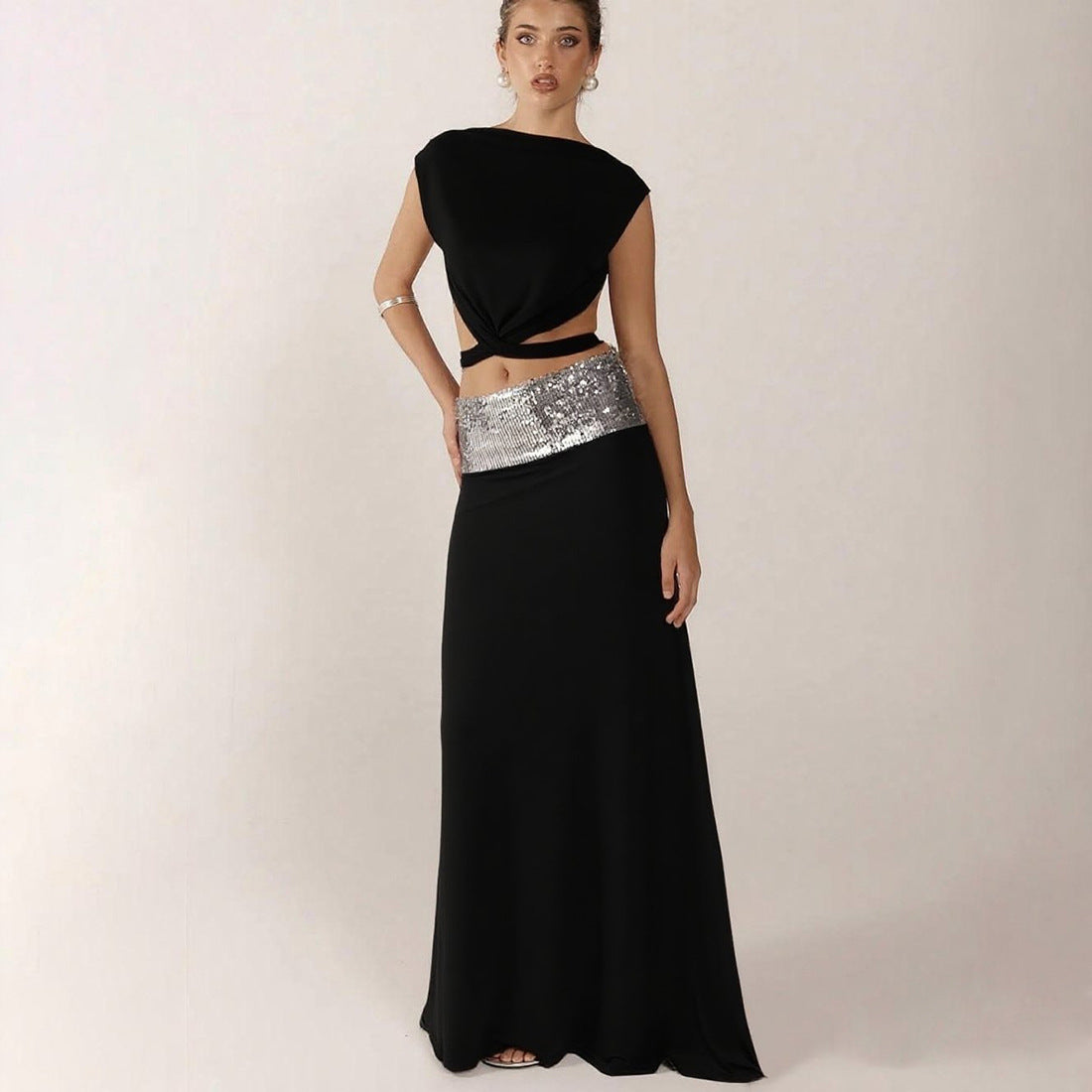 Elegant Backless Top Paired With A Patchwork Maxi Skirt