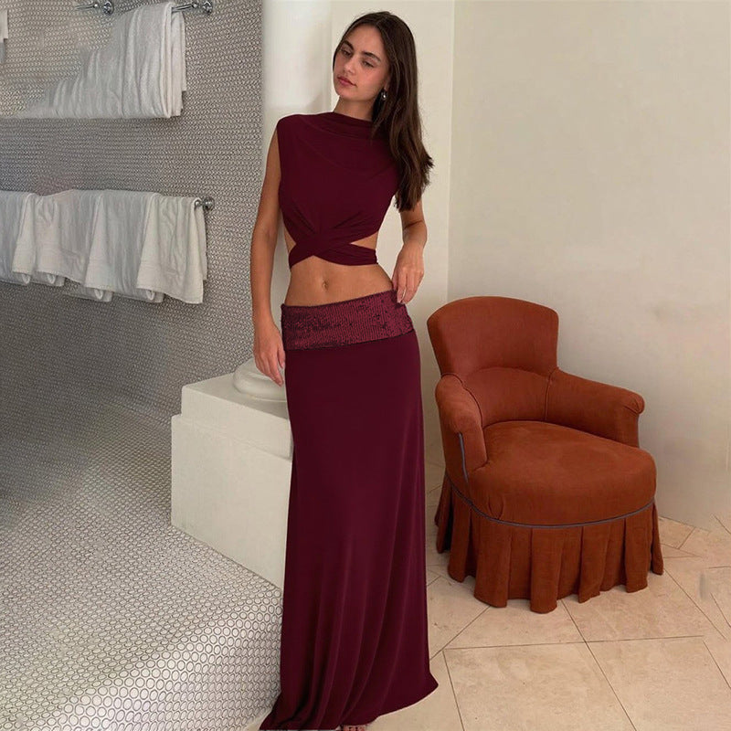 Elegant Backless Top Paired With A Patchwork Maxi Skirt