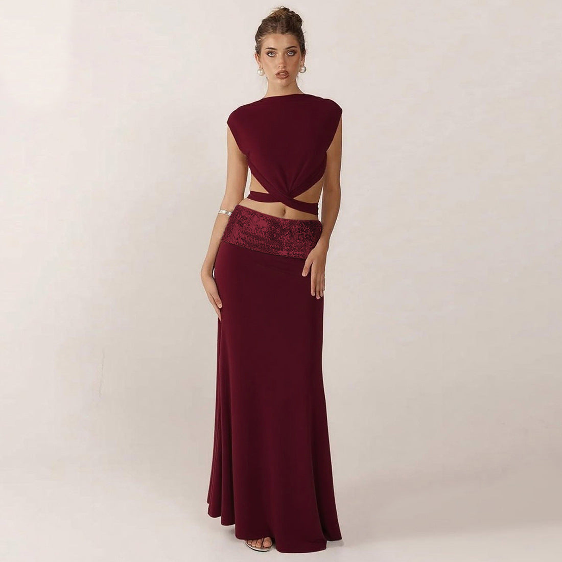 Elegant Backless Top Paired With A Patchwork Maxi Skirt